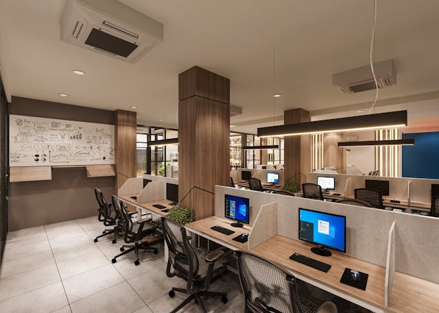 Modern open office workspace with cubicles and computers, representing the everyday reality of launching a new project or business in 2026.